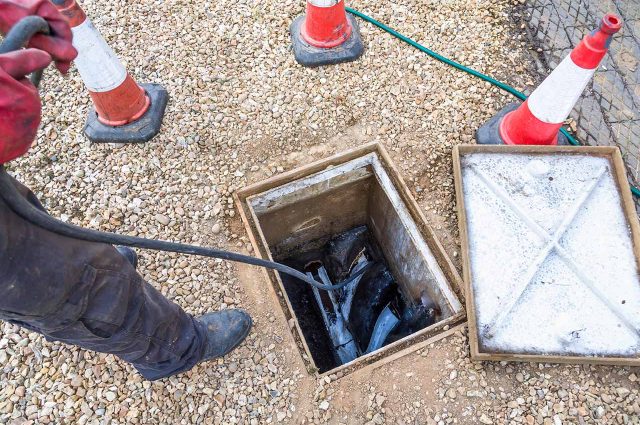 A drain being unblocked with high pressure jetting