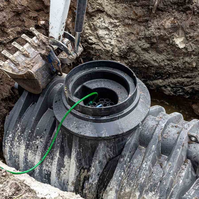 The placement of a sewage treatment plant in a home garden.