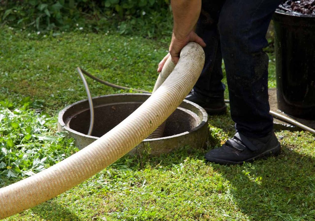 A pipe enters a septic tank.