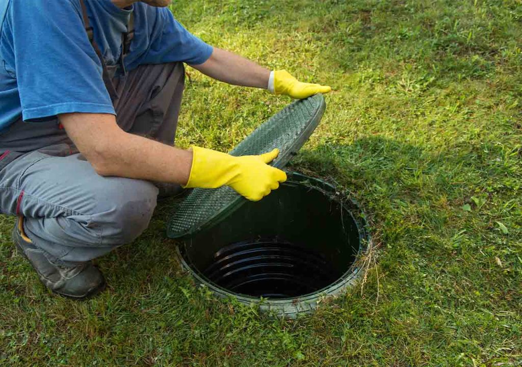 Lifting the manhole cover.