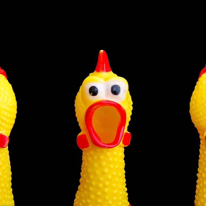 Three toy rubber chickens.