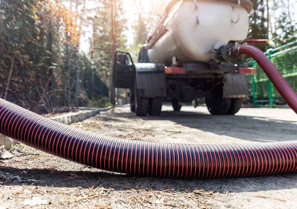 A lorry with a drainage pipe.