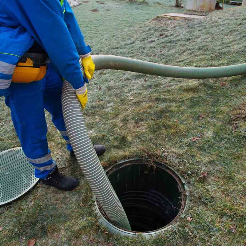 Emptying a septic tank.