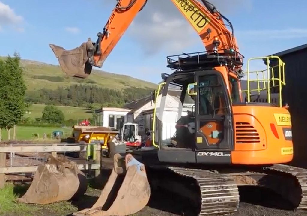 A digger and bulldozer installing a new sewage treatment plant at Provanston.