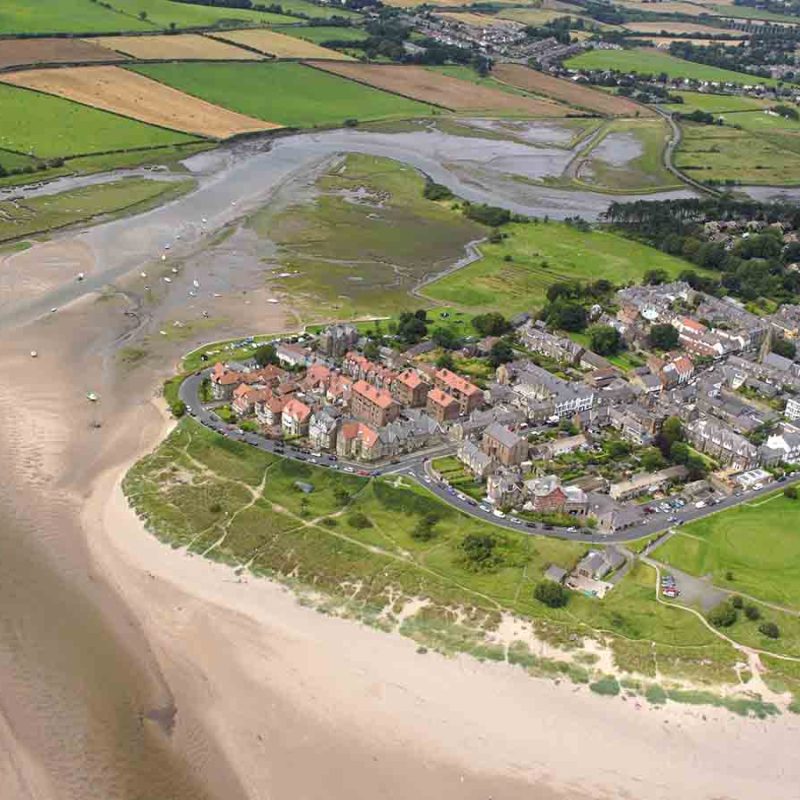 Alnmouth from above with a sandy beach.