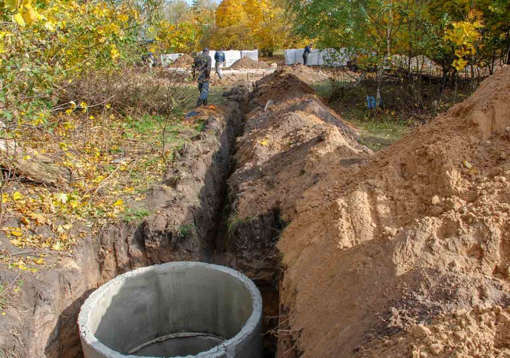 Installing a tank in the ground.