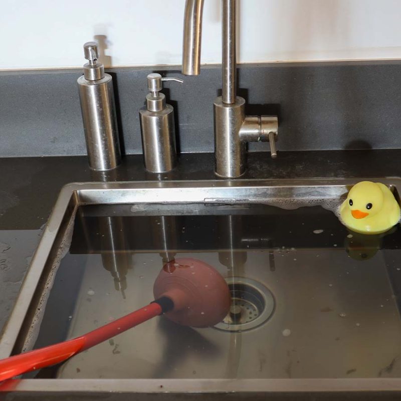 An overflowing kitchen sink.