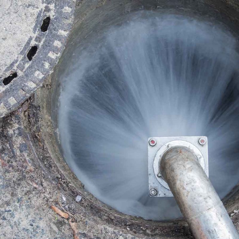 Water going into a manhole.