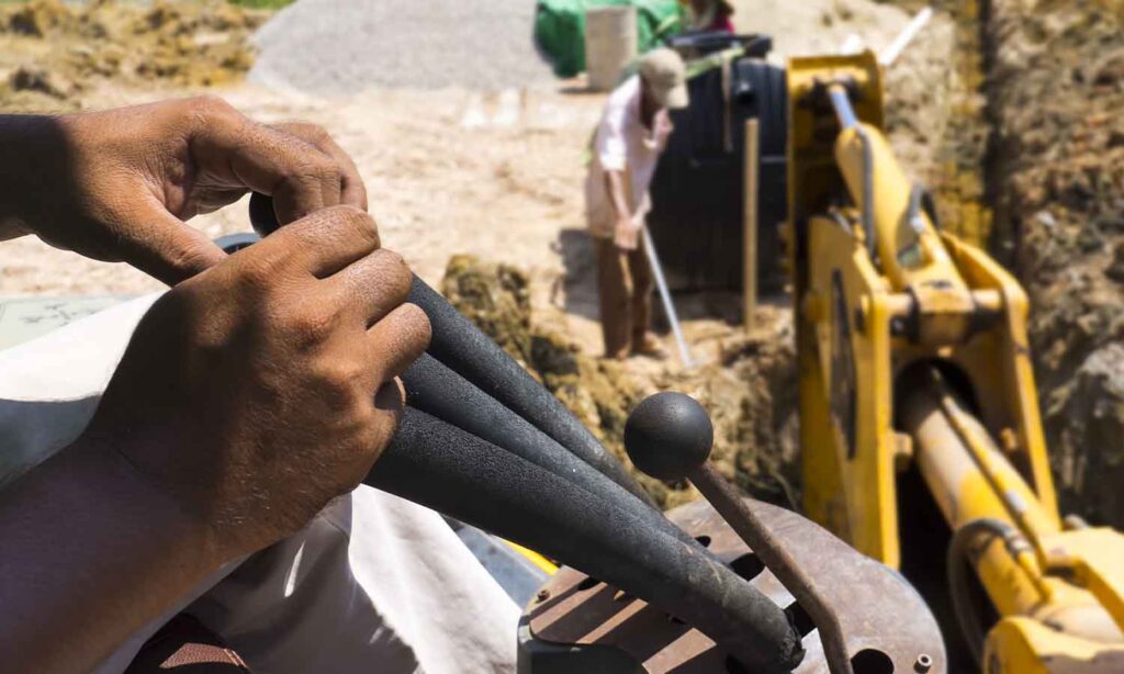 Close up of hands controlling a digger.