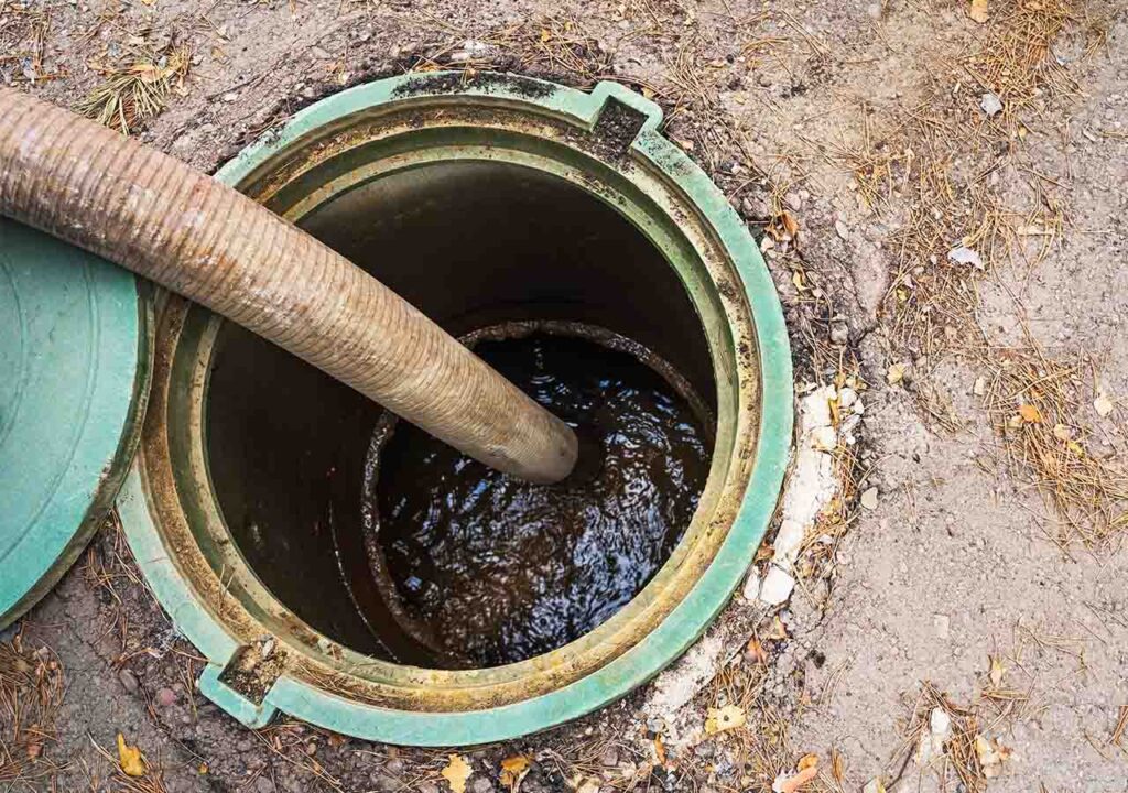 Emptying a full septic tank.